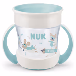 Basta piangere sul latte versato. La tazza NUK Magic Cup Mini con manici favorisce l’apprendimento di un corretto modo di ber ...