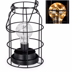 Donate al vostro salotto uno charme industrial con questa lampada decorativa. La luce da tavolo avvolta dalla gabbia in metal ...