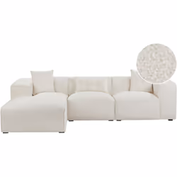 Divano ad angolo moderno con 3 cuscini decorativi. Un divano con terminale a chaise longue che diventa immediatamente il punt ...