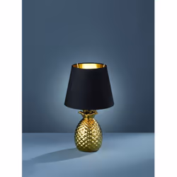 La lampada da tavolo PINEAPPLE di Trio Lighting presenta una base in ceramica finitura argento a forma di ananas e paralume i ...