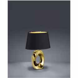 La lampada da tavolo TABA di Trio Lighting è composta da una struttura in ceramica color oro e paralume in tessuto nero con i ...