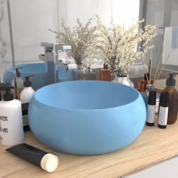 Il nostro lavabo di forma rotonda, realizzato in ceramica di alta qualità, è un'aggiunta elegante e senza tempo a qualsiasi b ...