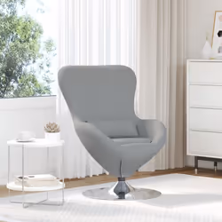 Questa poltrona moderna porta un tocco di classe a qualsiasi stanza con il suo rivestimento grigio chiaro e il design snodato ...